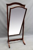 An Edwardian inlaid mahogany cheval mirror. By Howard and Sons. Ivorine label to reverse. 183cm