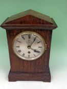 A rare RAF Officer’s desk clock. Plain arch top oak case with silvered dial and Roman numerals