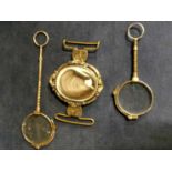 A Victorian pinchbeck clasp set with centre revolving oval locket with hair inset together with