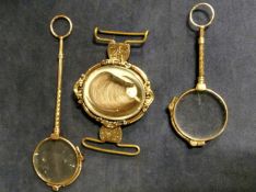 A Victorian pinchbeck clasp set with centre revolving oval locket with hair inset together with