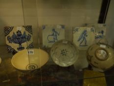 Three Korean bowls. 13, 14 and 15cm diameter. Together with a small saucer dish and four delft tiles