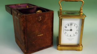 An early 20th Century gilt brass cased carriage clock timepiece. The white enamel dial signed