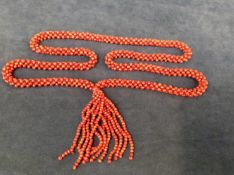 A 1920s/30s coral set sautoir with tassel.