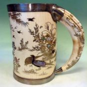 A Japanese silver mounted ivory Shibayama decorated tankard with tusk handle. The body applied