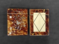 A Victorian ivory and tortoiseshell card case with geometric designs together with another