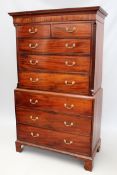 A George III mahogany chest on chest. Moulded edge cornice over two short and six long graduated