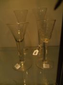 A pair of 19th Century conical glasses with spiral stems, folded feet. 20.5cm high and a plain