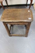 An early oak joint stool with shaped apron. 45 x 26cm.
