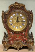 A 19th century small mantel clock with boule decoration and applied gilt brass mounts.