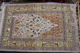 A Persian silk prayer mat.