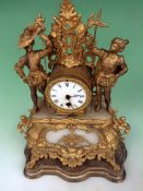 A Victorian gilt metal and marble inset mantel clock. Surmounted with figures. Enamel dial and