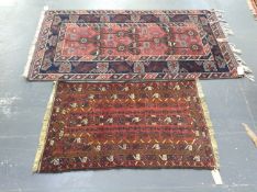 A Turkish Tribal rug and a Belouch prayer rug, largest 216 x 120cm.