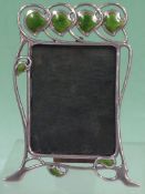 An Art Nouveau silver and green guilloche enamel photograph frame. Bears import duty marks for