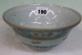 A Chinese bowl with butterfly and floral turquoise blue border. Stylized character mark to base.