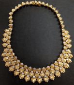 A fine gold and diamond fringe necklace by Van Cleef and Arpels. Made in France. The clasp stamped