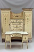 An early 1900s painted pine bedroom suite of neo-classical design comprising wardrobe with fitted