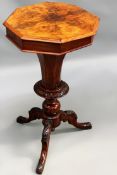 An antique Victorian inlaid walnut trumpet form work table. Octagonal lift top enclosing fitted