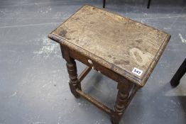 An 18th Century oak joint stool with moulded edge top over turned legs united by stretchers. 45cm