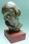 Glady’s Barrom (early 20th Century) bronze bust of a girl on oak plinth. 13cm high.