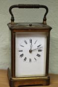 A late 19th Century French repeater carriage clock with white enamel dial. 13cm high.