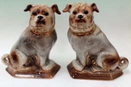 A pair of Staffordshire pottery Bo’ Ness models of pug dogs. 30cm high.