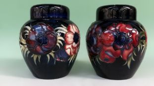 A pair of Moorcroft baluster ginger jars with covers. 14cm high.
