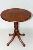 A 19th Century oak tilt top occasional table on turned column and quadruped supports.