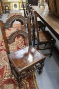 A set of four early oak peg jointed back stools. Each with twin carved back supports. Plain plank