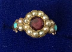 An early Victorian seed pearl turquoise and gem set ring. Inscribed ‘Remember Me’.