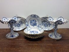 A late 19th Century Meissen onion pattern part dessert service. With pierced borders. Decorated with