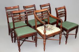 Six carved mahogany Regency dining chairs. Reeded bar backs turned tapered legs. With ‘X’ form