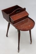 A Regency mahogany plate and cutlery stand in the manner of Gillows with pierced carrying handle.