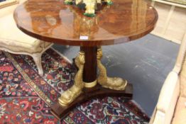 A 19th Century and later Continental gueridon centre table. Quarter veneered and inlaid top over