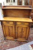A 19th Century Arts and Crafts oak chiffonier/side cabinet. Chip carved and chamfered decoration.