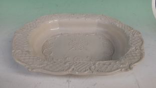 A Staffordshire type white salt glazed dish with embossed rim and centre. 35 x 28cm.