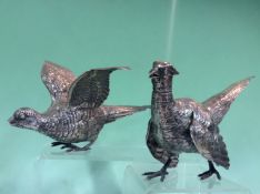 A rare pair of silver models of cock and hen pheasants. Sheffield 1925. Makers mark R H H.