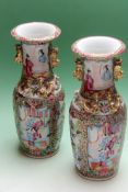 A pair of Cantonese baluster vases with applied gilded handles. 25cm high.