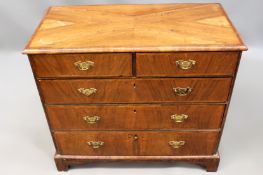 An 18th Century and later walnut and crossbanded chest of two short and four long drawers. On shaped