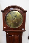 An early 19th Century mahogany longcase clock with circular brass dial. Eight day movement.