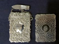 An Edwardian silver card case and clasp with repousse scrolled decorations. Birmingham 1904. Maker H