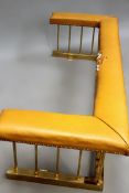 A brass Edwardian style club fender. Leather seat. 186cm wide. 66cm deep.