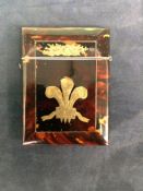 A Victorian tortoiseshell card case with gilded Prince of Wales feather design.