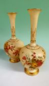 A pair of Royal Worcester blush ivory ground vases. With elongated flared necks. Painted with sprays
