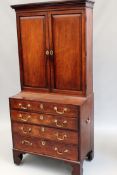 A mahogany Georgian and later gentleman’s library cabinet. Two door upper section above four