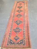 An antique Persian Tribal runner, 412 x 98cm.