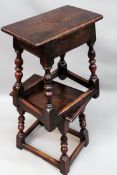 A near pair of fruitwood and elm joint stools on splayed turned legs united by stretchers.
