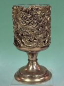 A 19th c. silver gilt goblet with foliate scroll decoration and glass liner. Wm. Comyns London 1897.