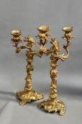 A pair of 19th Century French ormolu two branch candelabra with stylized ‘C’ scroll designs. 49cm