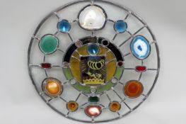 A circular leaded window. With inset agate specimens. 57cm diameter.