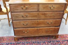 A George III country oak chest. Fitted with two short and three long graduated drawers. 109cm